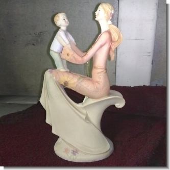 Read full article PORCELAIN FIGURE OF MOTHER WITH HER SON (15X25 CENTIMETERS)